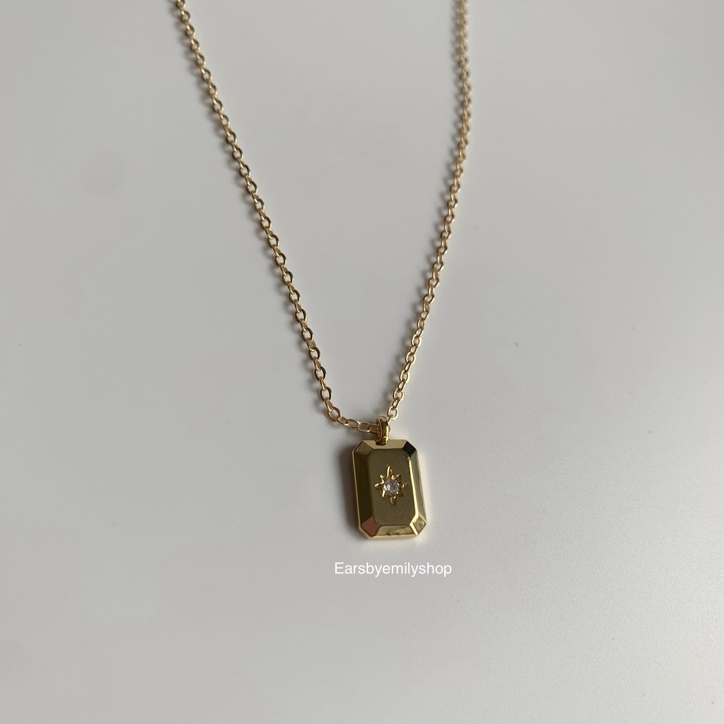 Gold plated rectangle pendant with white crystal diamanté necklace