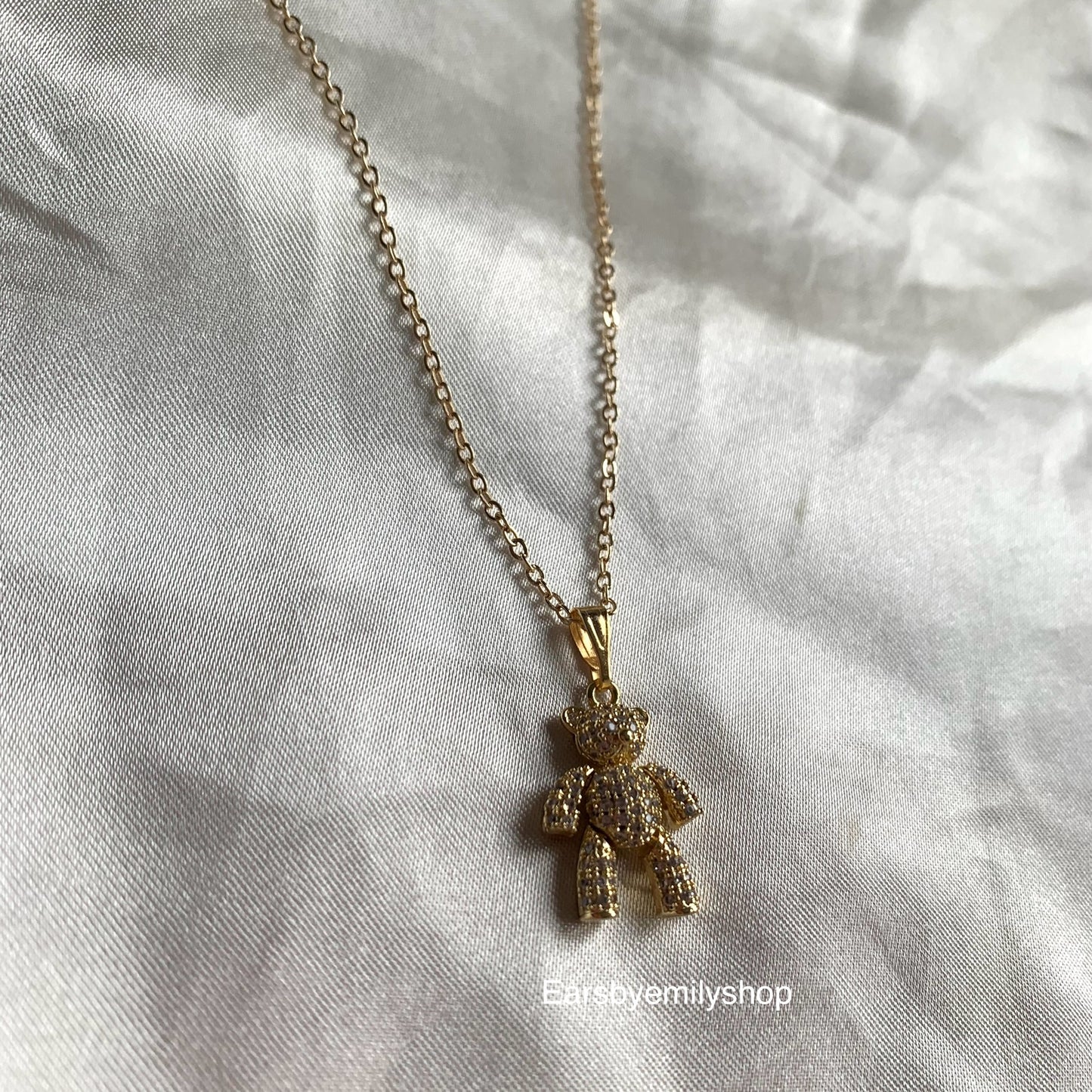 Gold plated moveable teddy bear with white crystal diamanté necklace