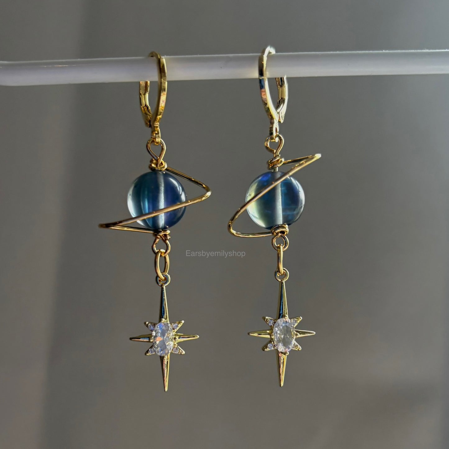Gold plated celestial Saturn planet dangle hoop earrings with diamanté star