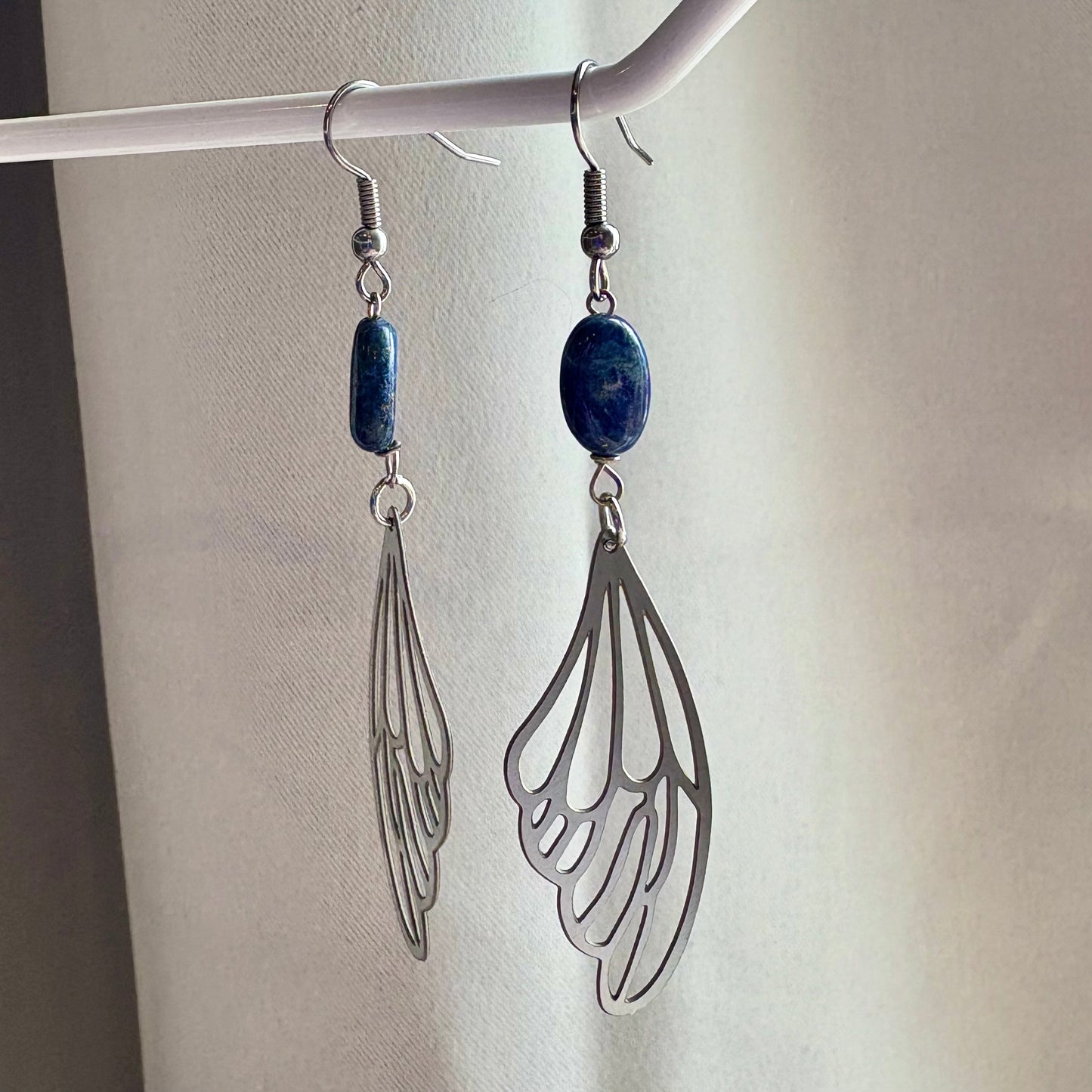 Stainless steel fairy butterfly wing dangle earrings with blue lapis lazuli oval crystals