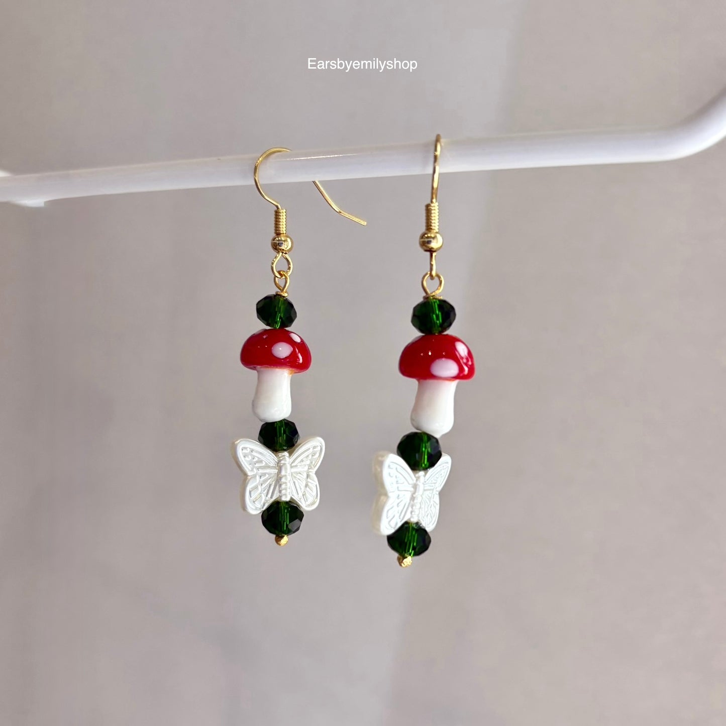 Gold plated mushroom and butterfly dangle earrings