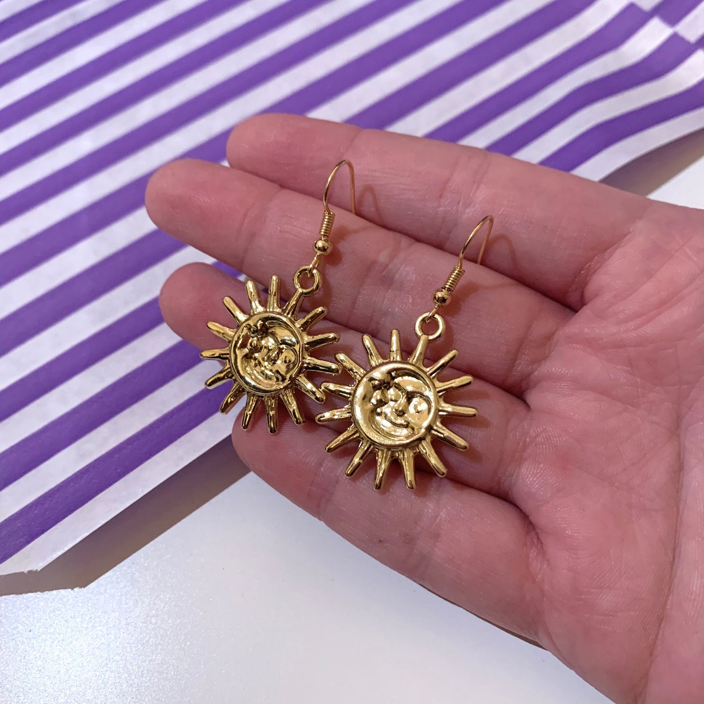 Cool quirky gold sun and moon face celestial dangle earrings