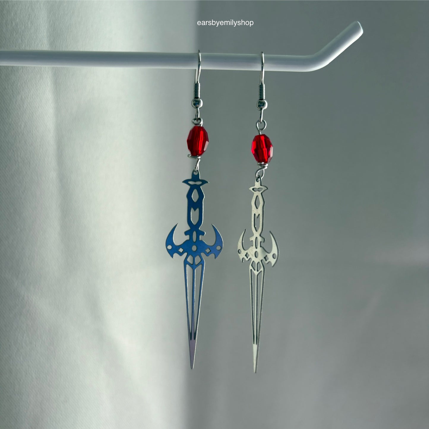 Stainless steel silver cool sword earrings with red or green bead