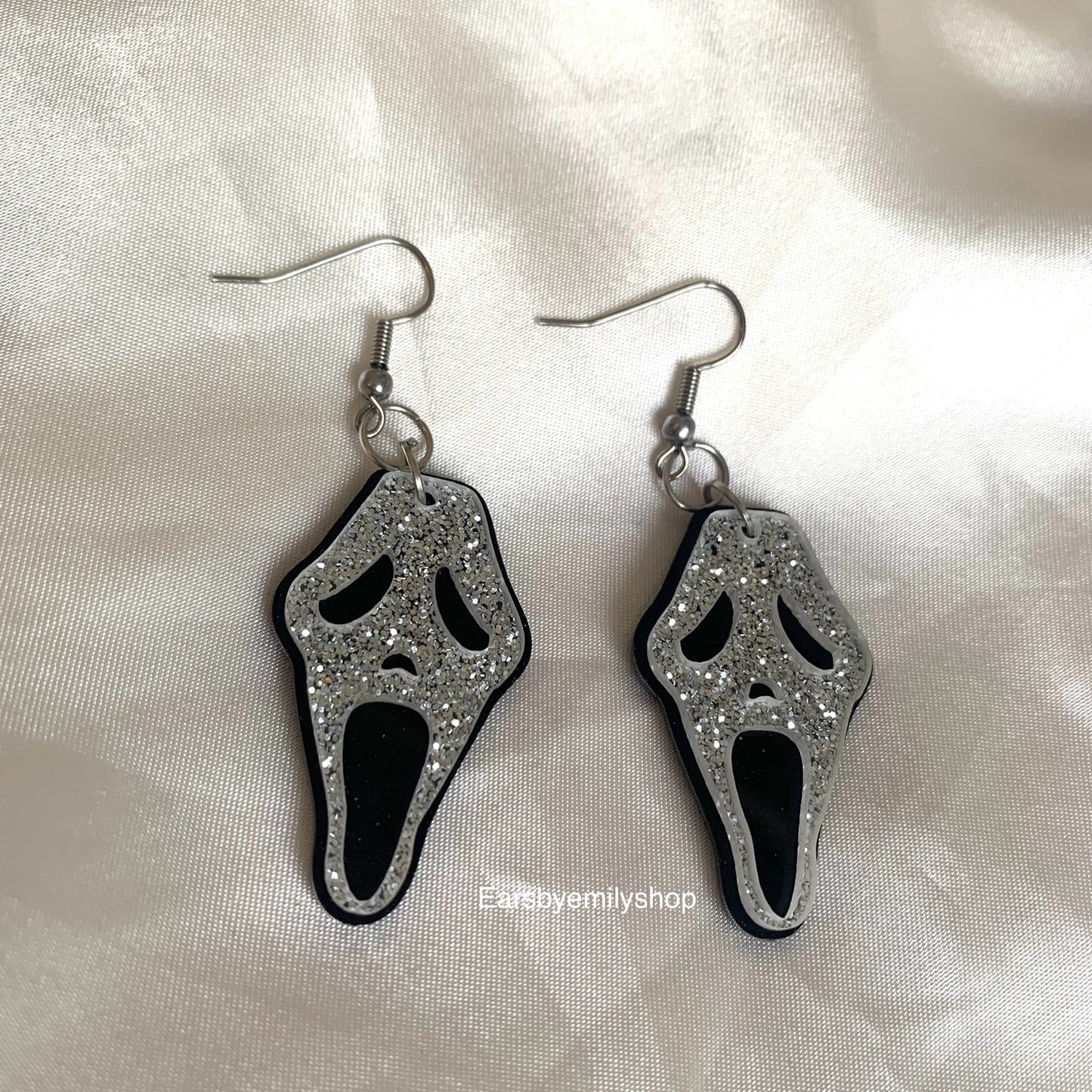 Black and glitter silver Halloween face earrings