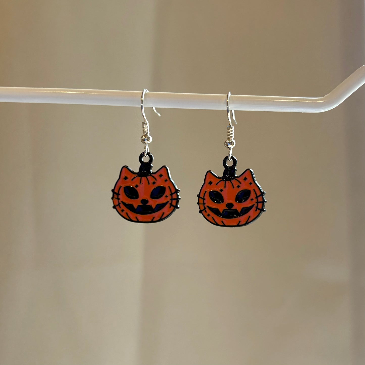 Cool orange pumpkin cat Halloween earrings on hypoallergenic surgical steel hooks