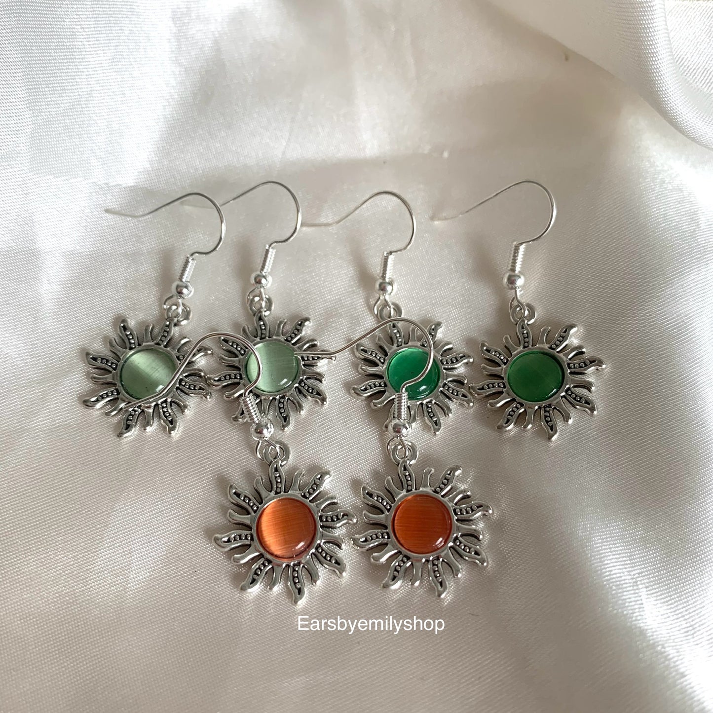 Silver orange or green centre feature sun drop dangle earrings