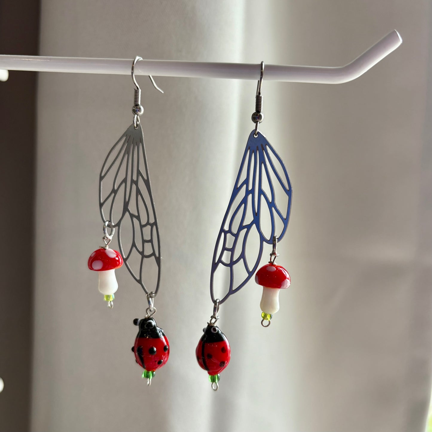 Stainless steel silver fairy wing earrings with mushrooms and ladybirds