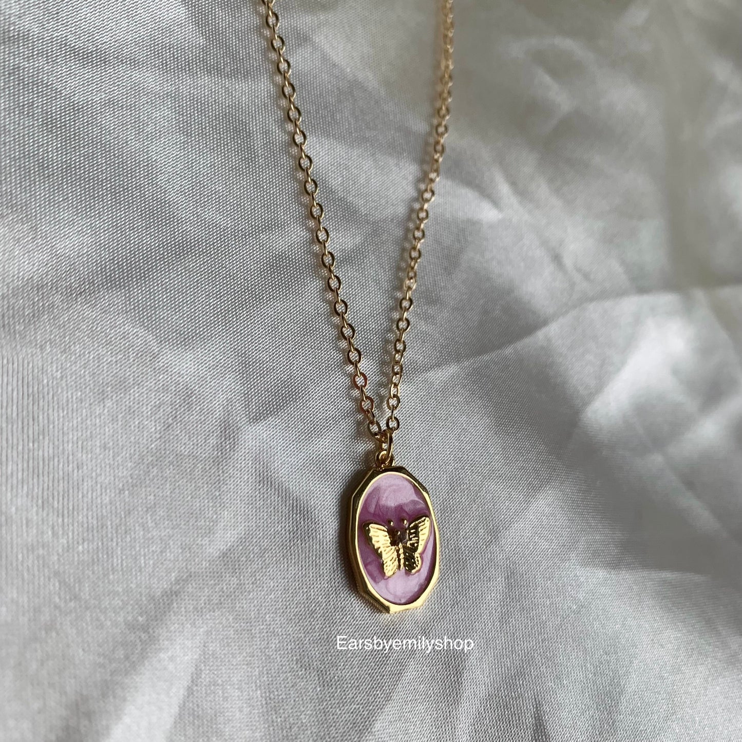 Gold plated oval pink enamel mother with butterfly pendant necklace