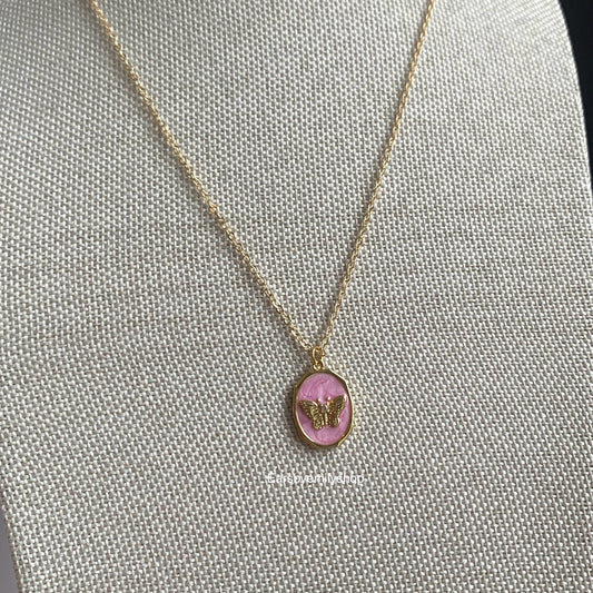 Gold plated oval pink enamel mother with butterfly pendant necklace