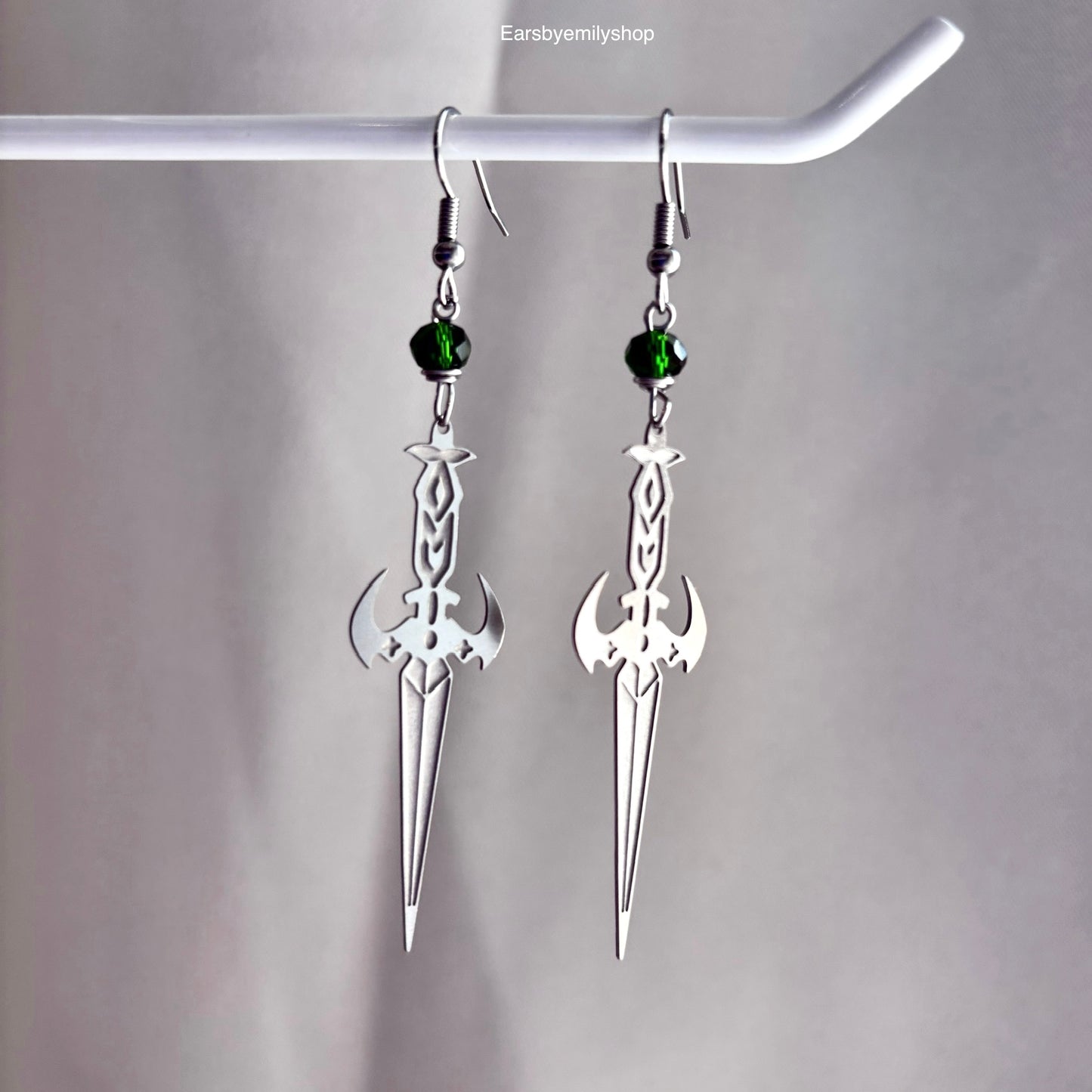 Stainless steel silver cool sword earrings with red or green bead