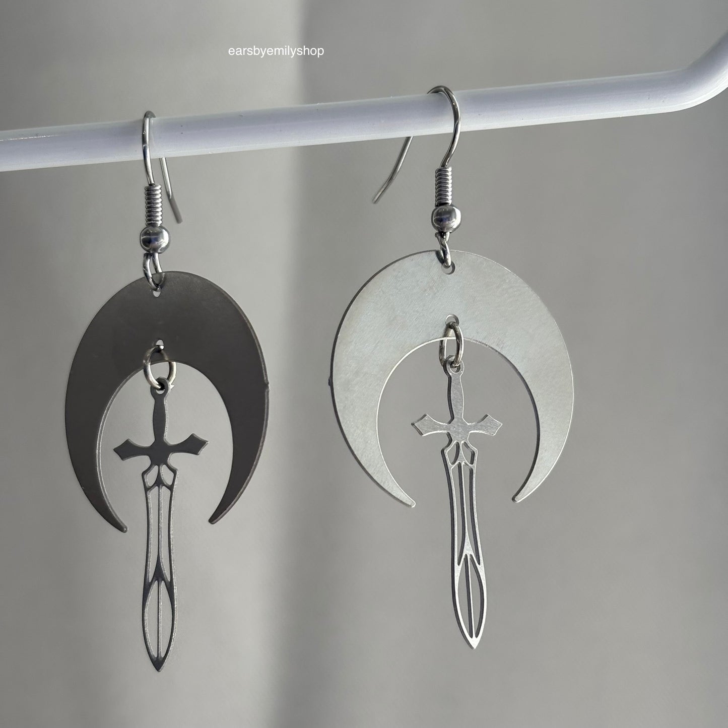 Cool stainless steel moon with swords silver earrings