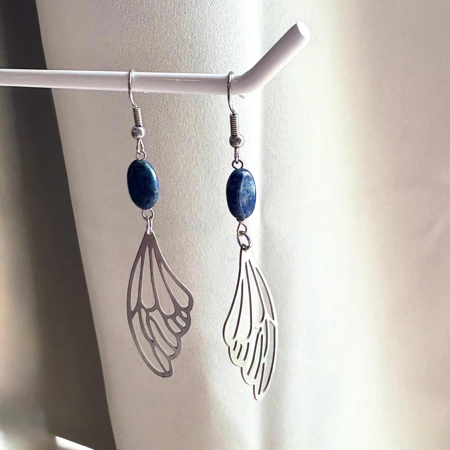 Stainless steel fairy butterfly wing dangle earrings with blue lapis lazuli oval crystals