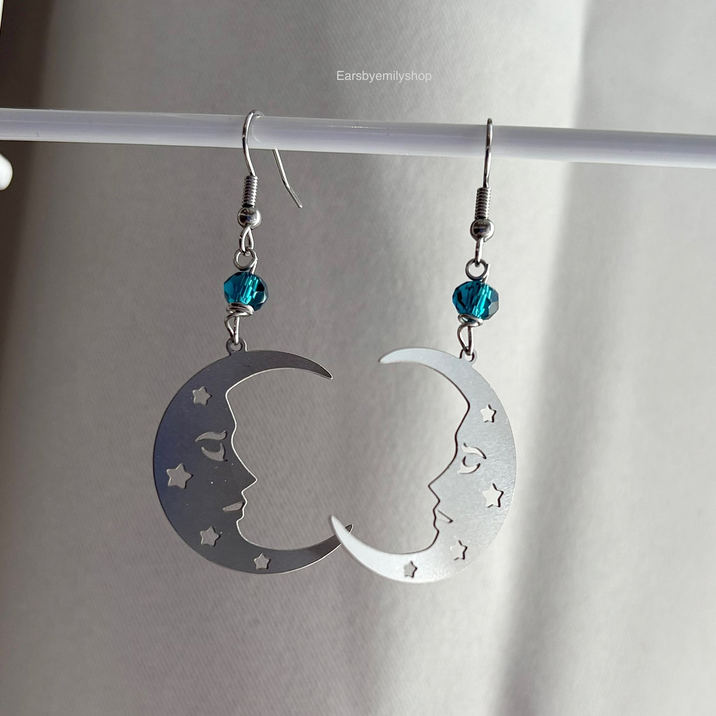 Stainless steel silver statement moon face earrings with blue beads