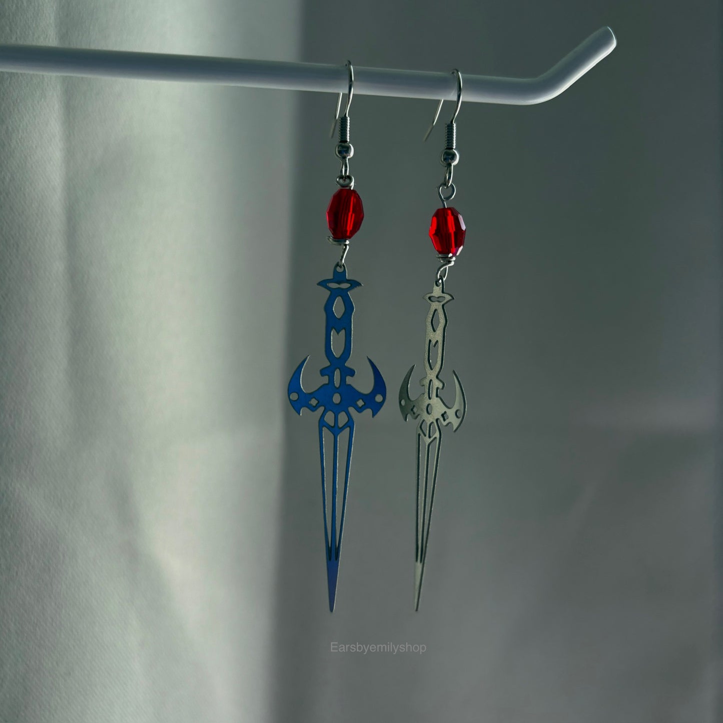 Stainless steel silver cool sword earrings with red or green bead