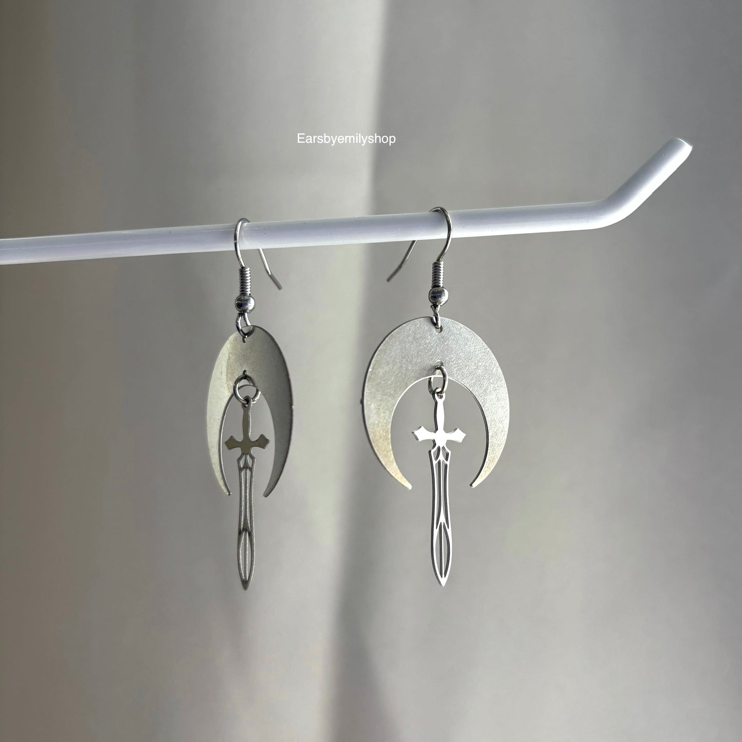 Cool stainless steel moon with swords silver earrings