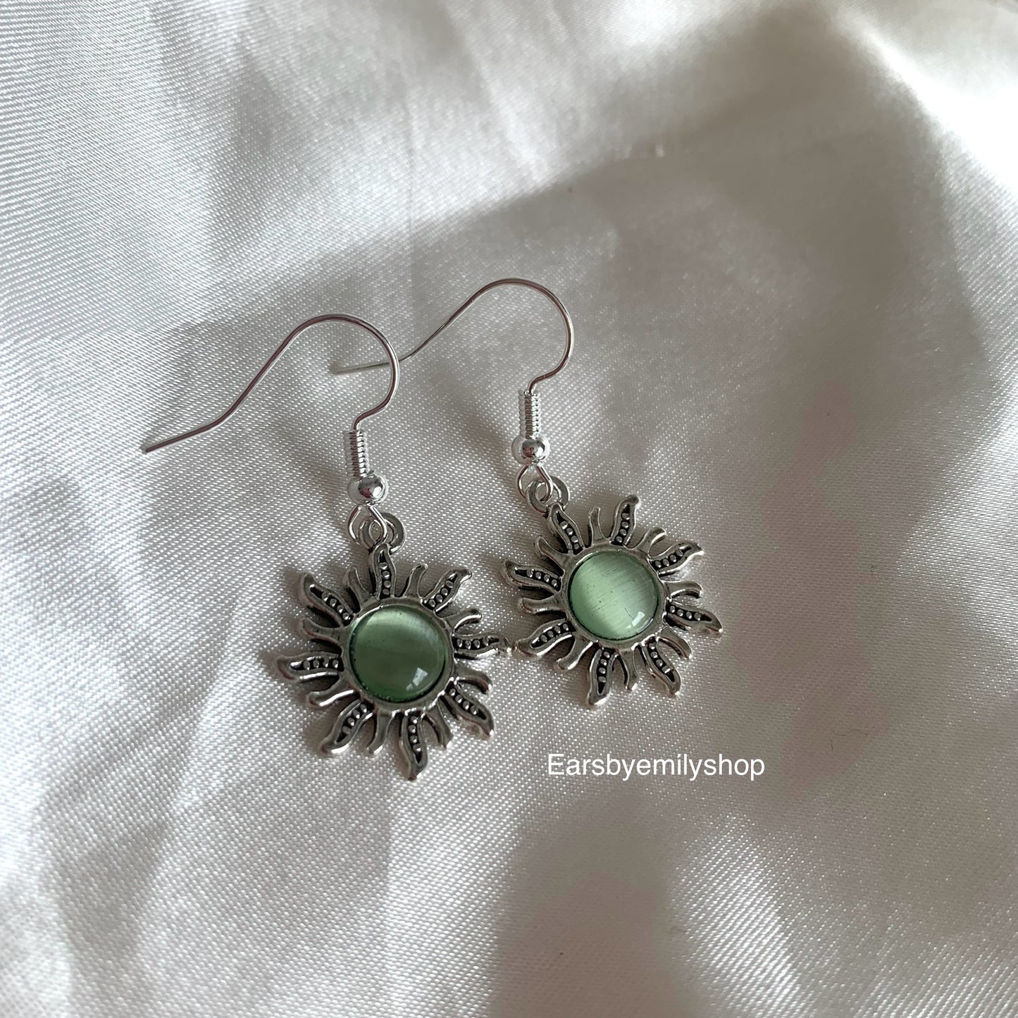 Silver orange or green centre feature sun drop dangle earrings