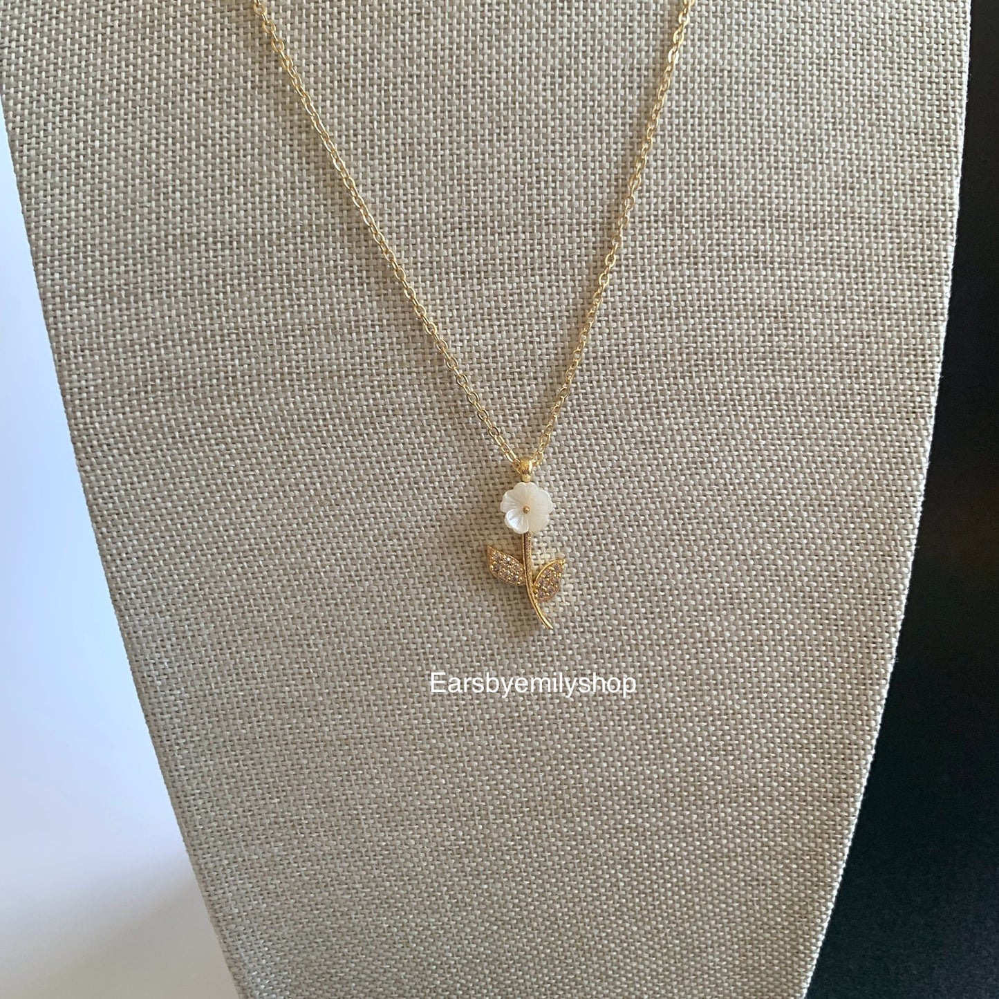 Gold plated white flower pendant with white crystal diamanté necklace