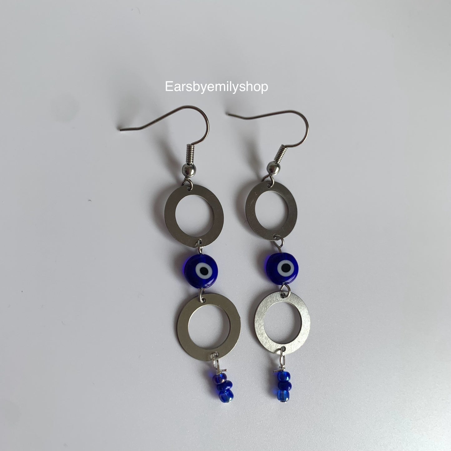 Stainless steel circle and blue evil eye bead statement dangle earrings