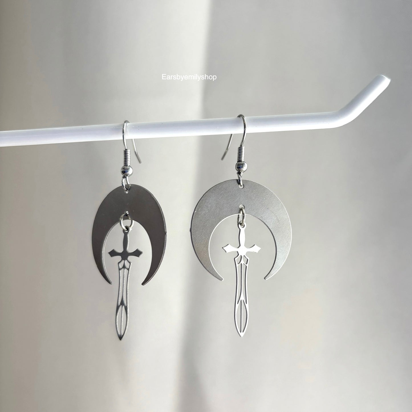 Cool stainless steel moon with swords silver earrings