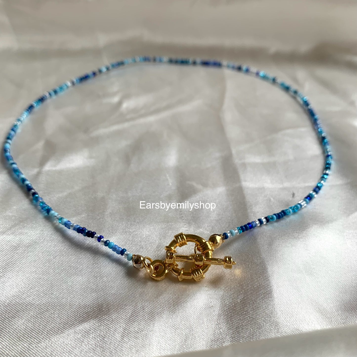 Handmade beaded blue and necklace with gold plated toggle clasp closure