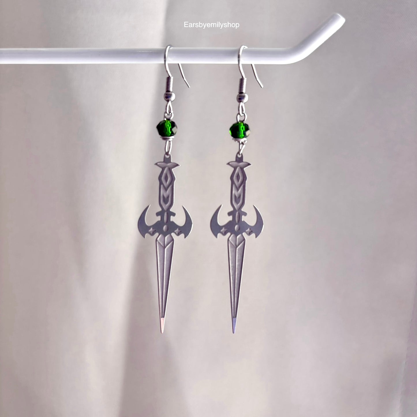 Stainless steel silver cool sword earrings with red or green bead