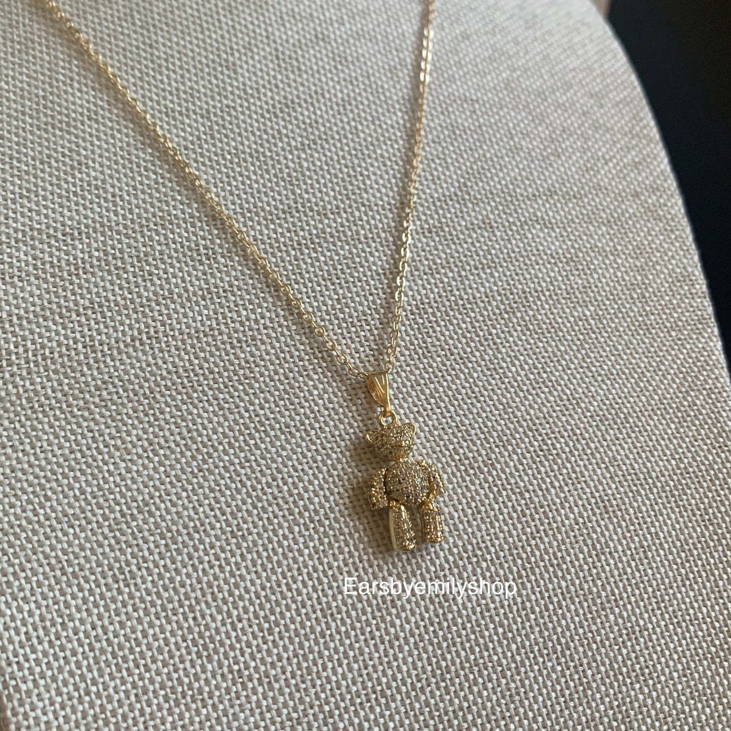 Gold plated moveable teddy bear with white crystal diamanté necklace