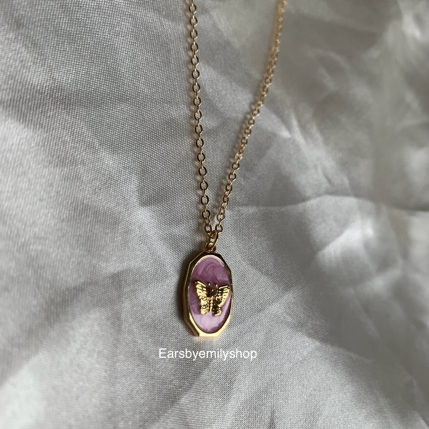 Gold plated oval pink enamel mother with butterfly pendant necklace