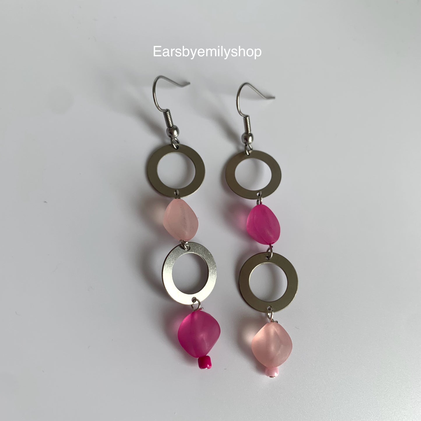 Stainless steel circle and asymmetrical pink bead statement dangle earrings