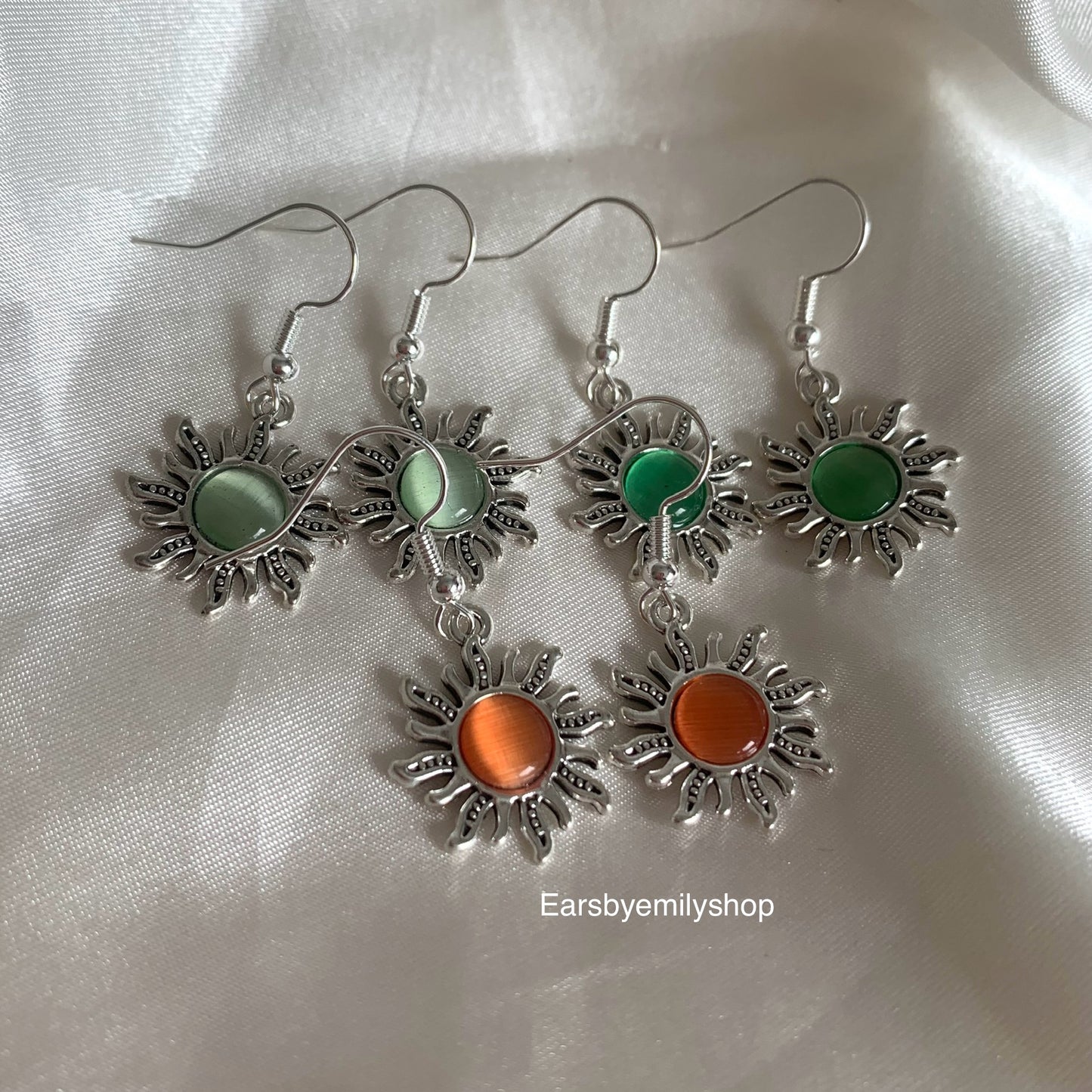 Silver orange or green centre feature sun drop dangle earrings