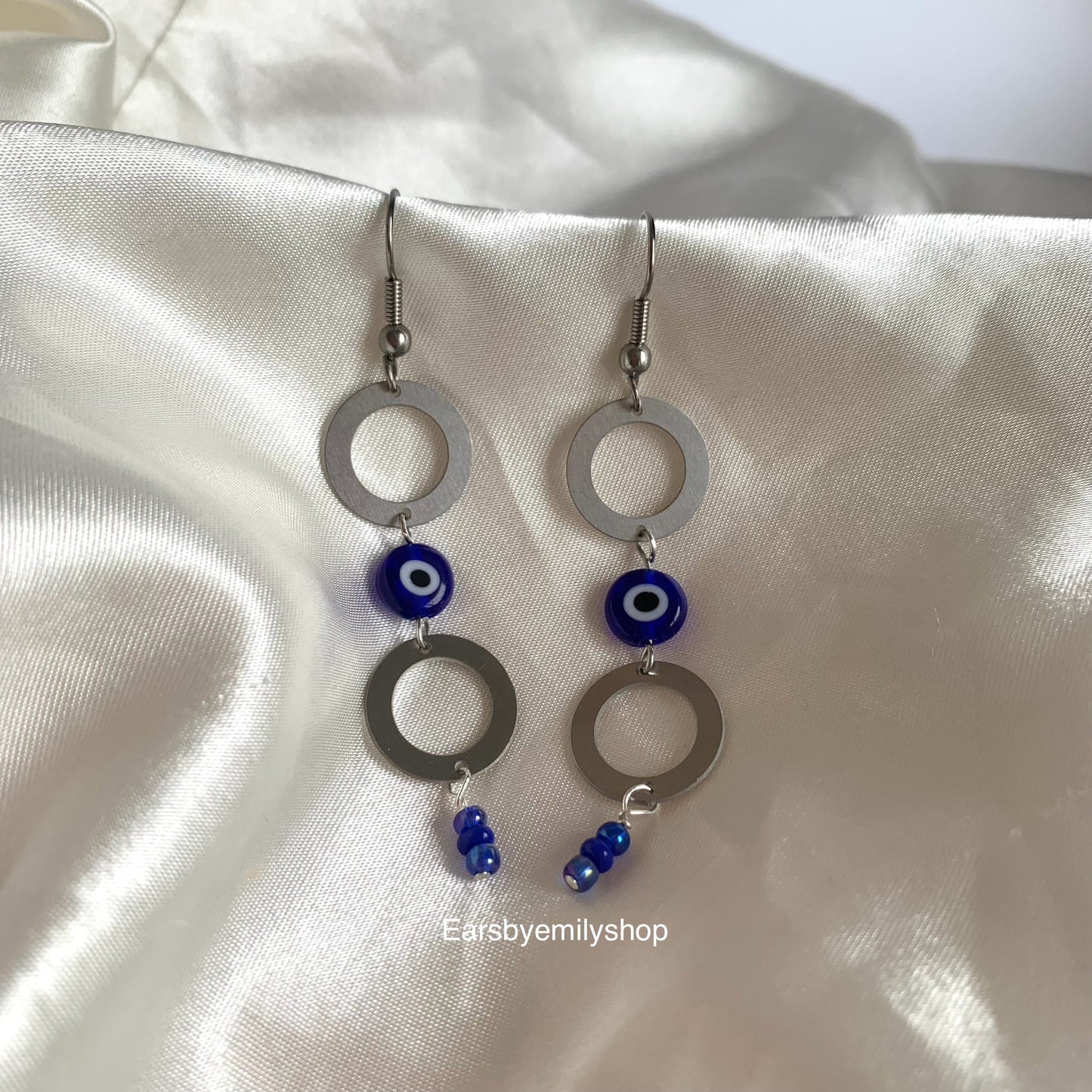 Stainless steel circle and blue evil eye bead statement dangle earrings