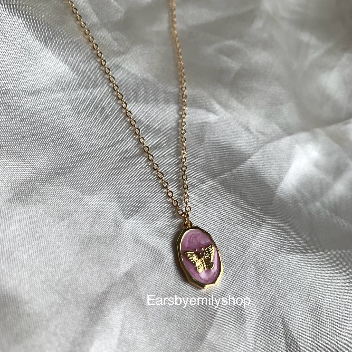 Gold plated oval pink enamel mother with butterfly pendant necklace