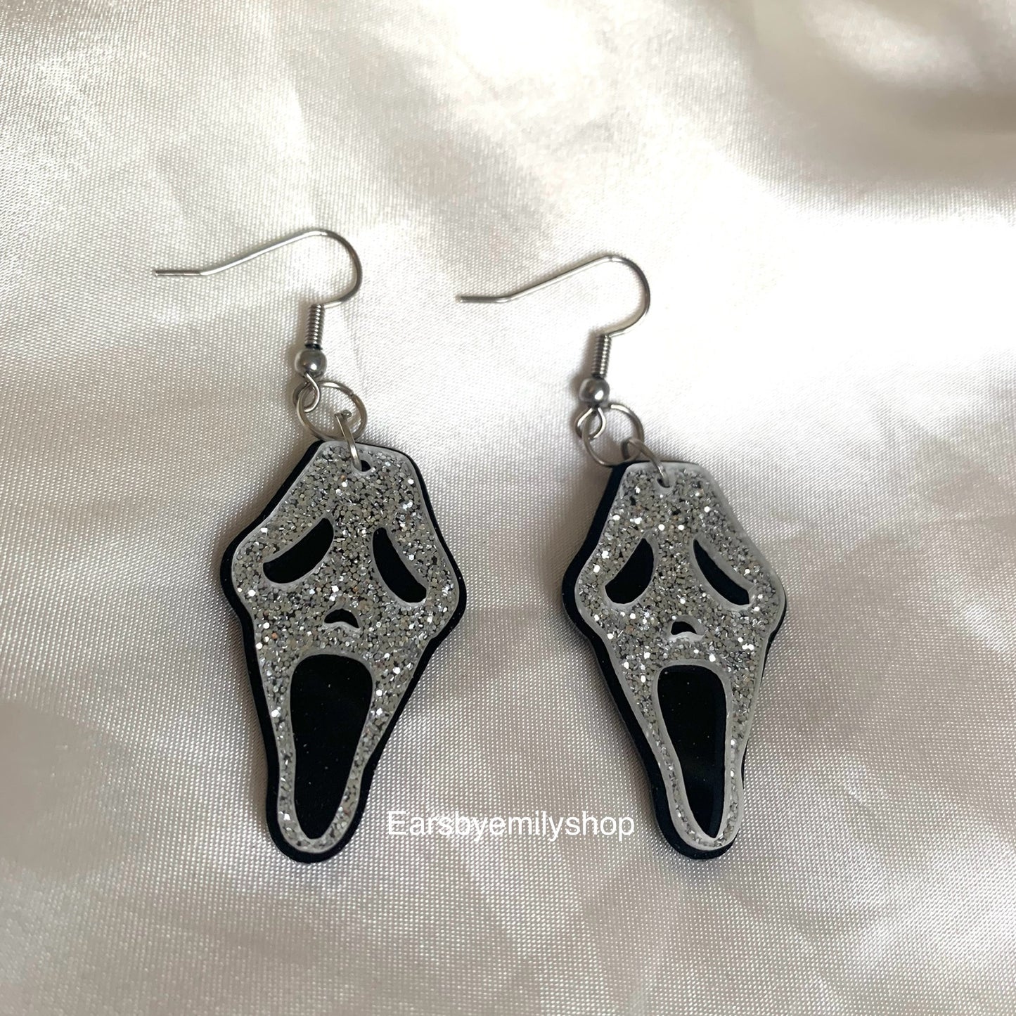 Black and glitter silver Halloween face earrings