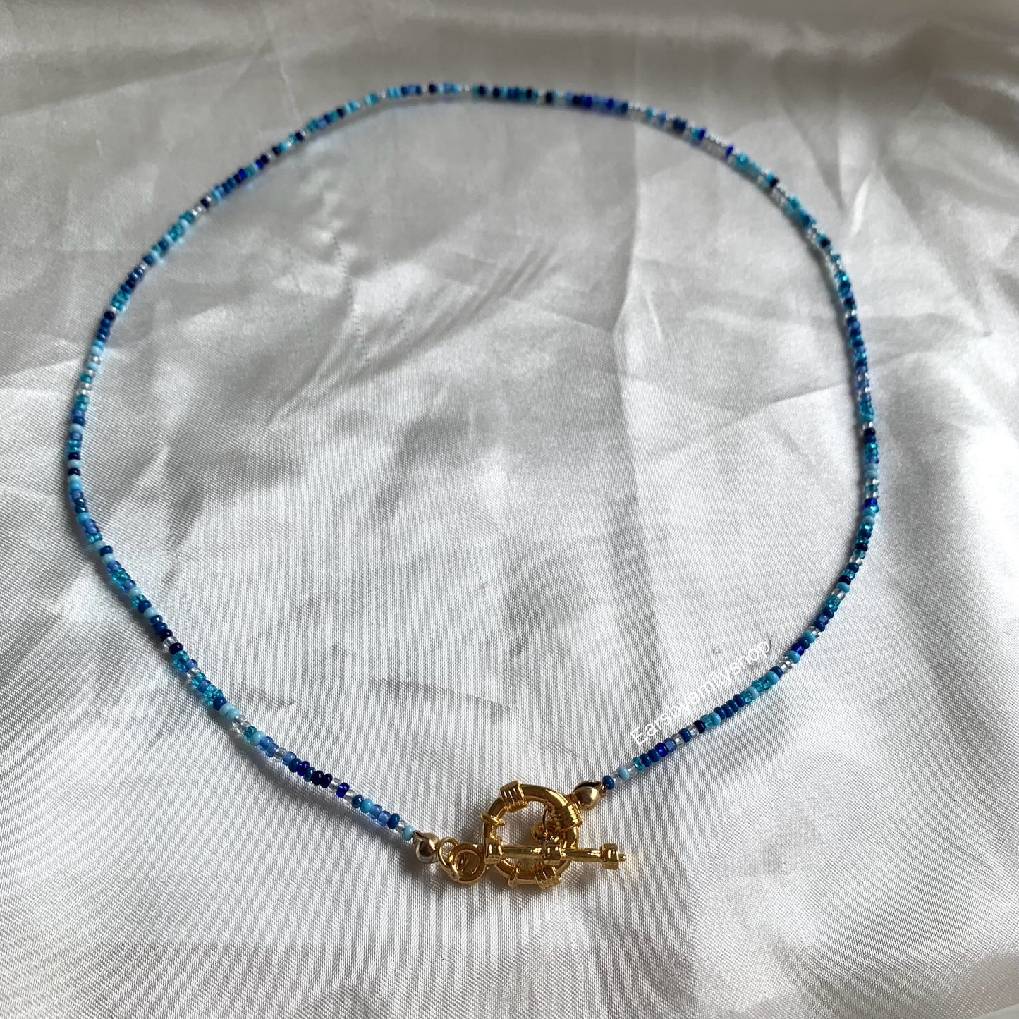 Handmade beaded blue and necklace with gold plated toggle clasp closure