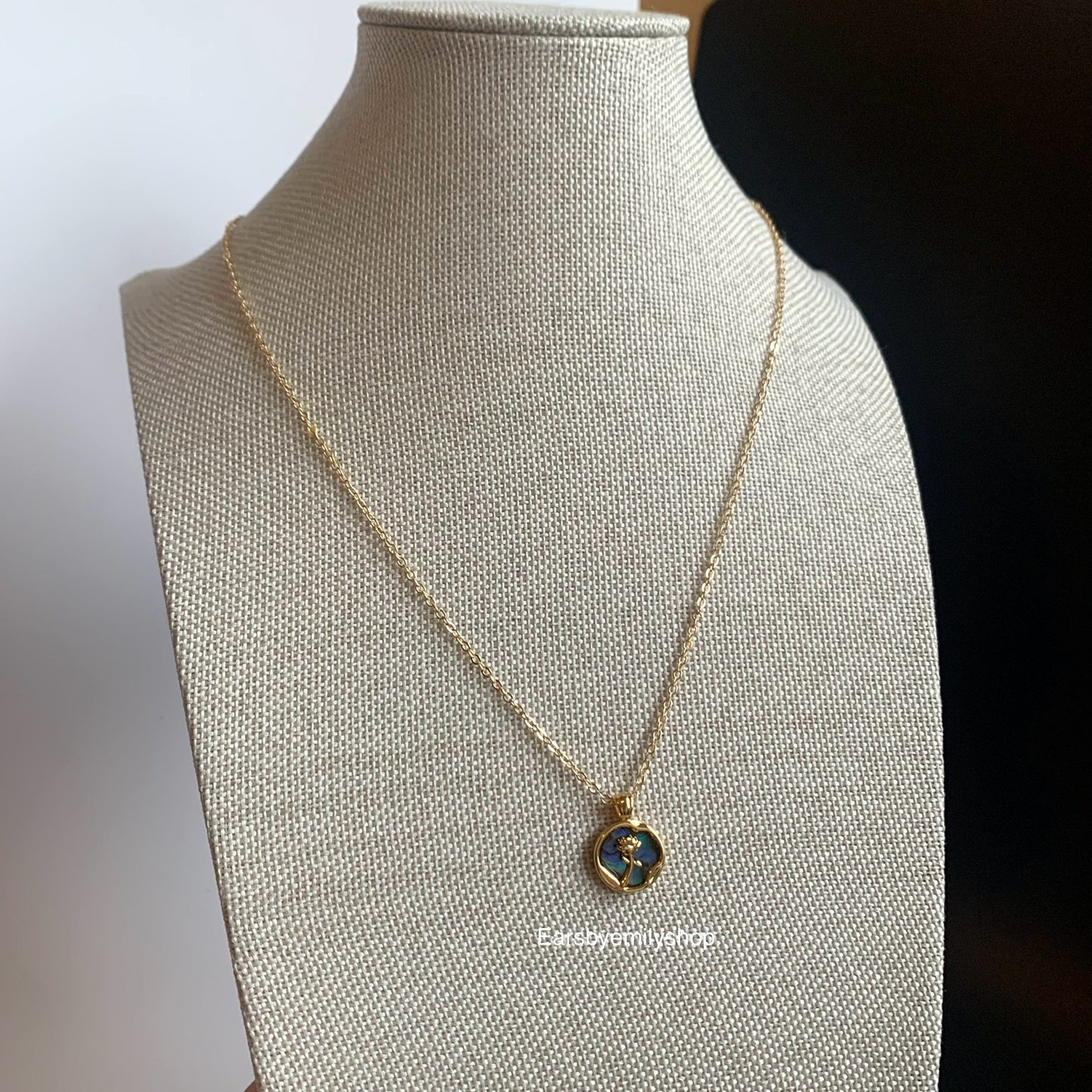 Gold plated circle mother of pearl with rose pendant necklace