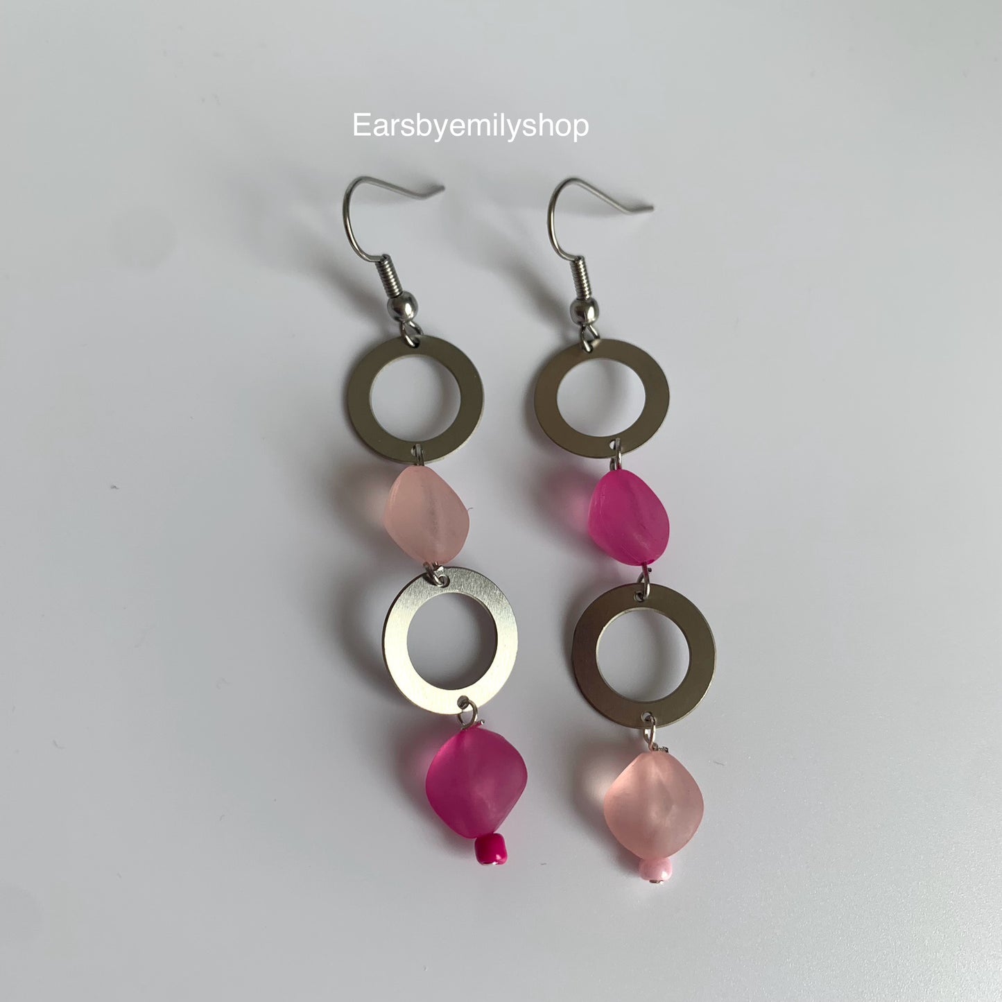 Stainless steel circle and asymmetrical pink bead statement dangle earrings