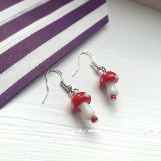 Cool quirky red and white glass lamp work drop dangle earrings on silver plated hooks.