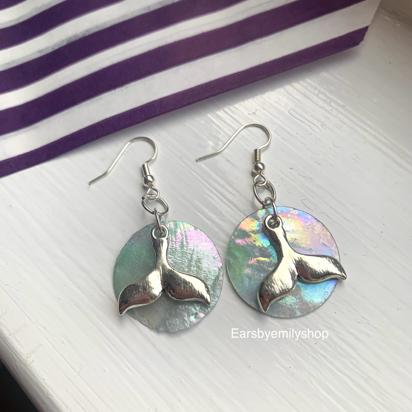 Cool quirky  beach inspired blue sea shell disc with dolphin tail on silver plated hooks