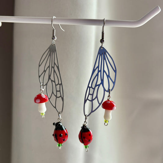 Stainless steel silver fairy wing earrings with mushrooms and ladybirds
