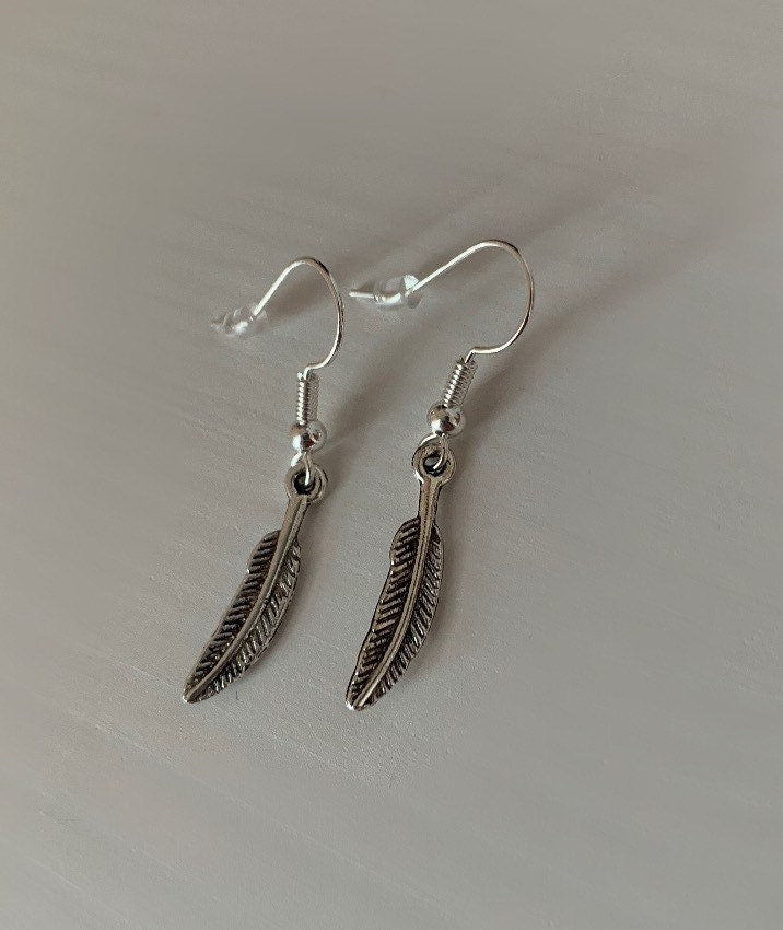 Silver bird feather dangle earrings