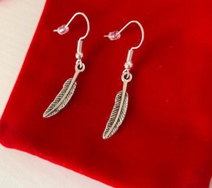 Silver bird feather dangle earrings