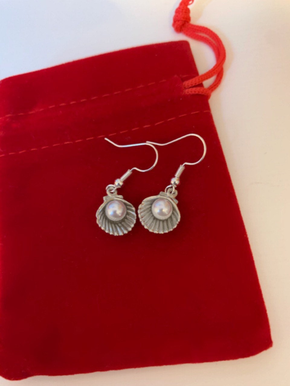 Silver clam with faux pearl dangle earrings