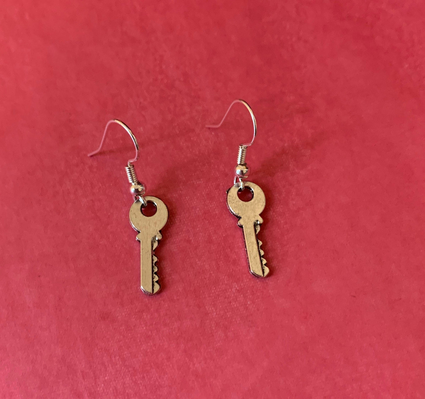 Little silver key dangle earrings