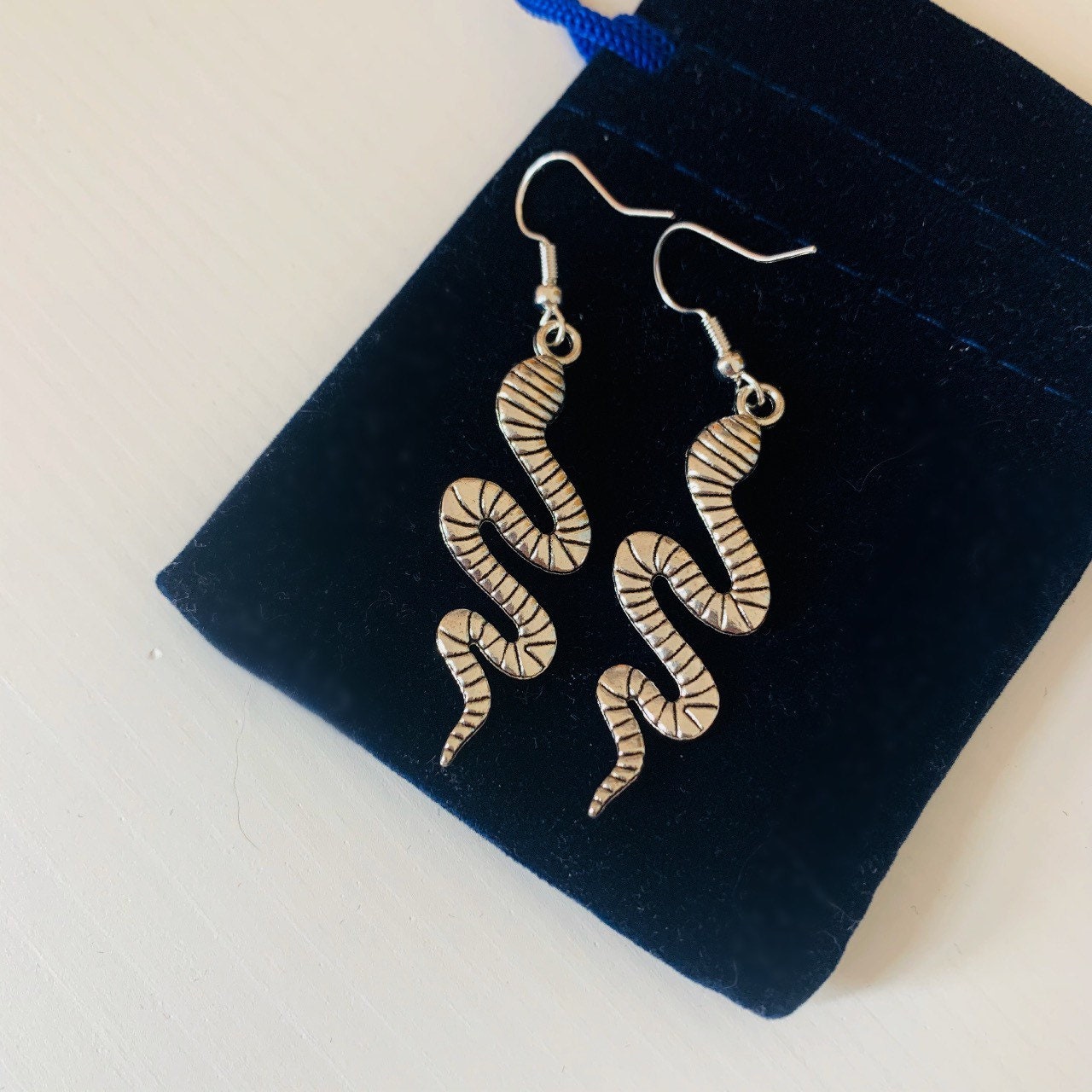 Silver snake dangle earrings