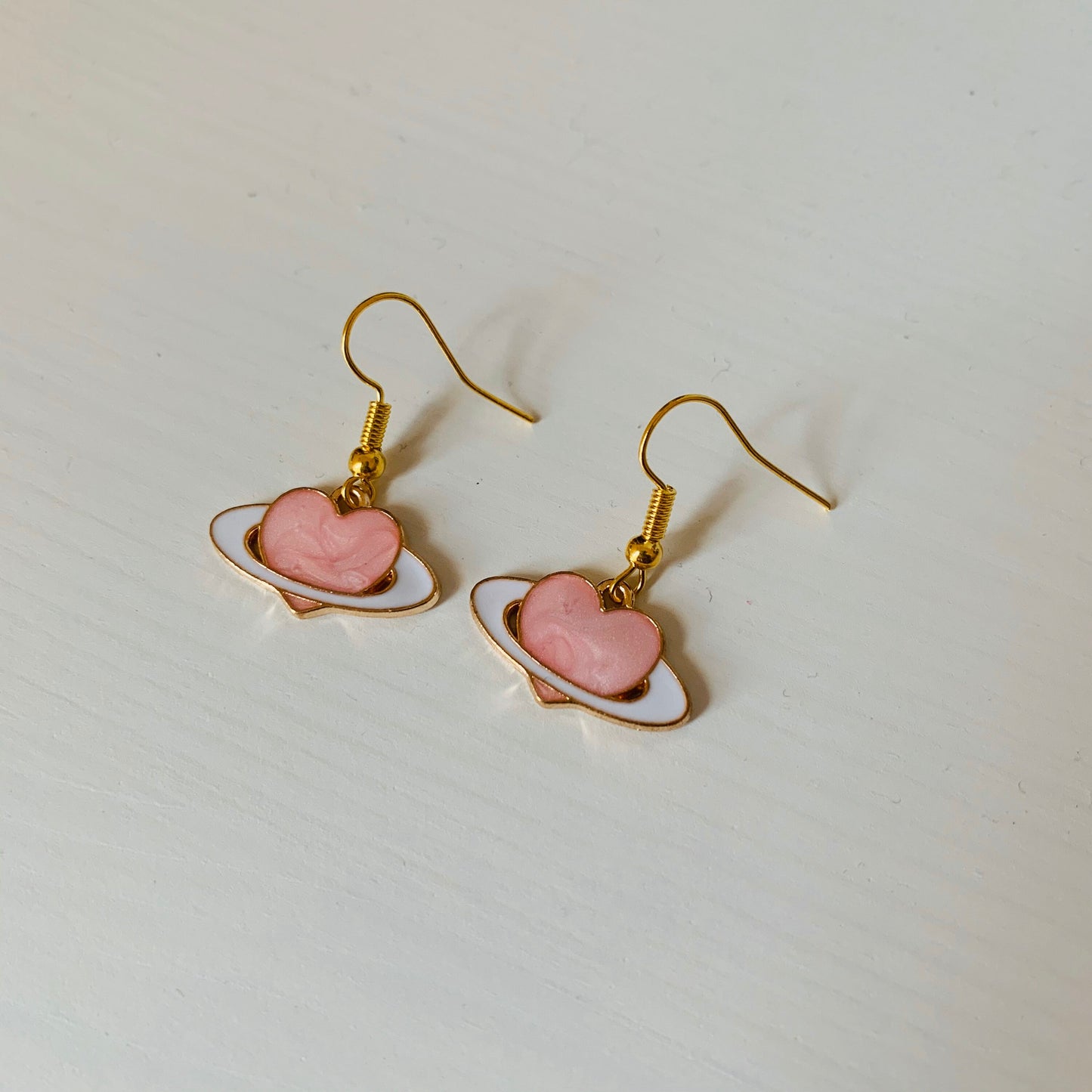 Gold and pink heart saturn planet dangle earrings