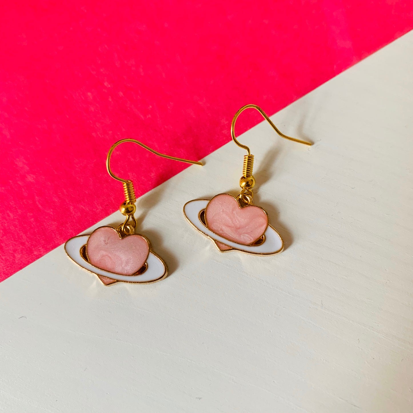 Gold and pink heart saturn planet dangle earrings