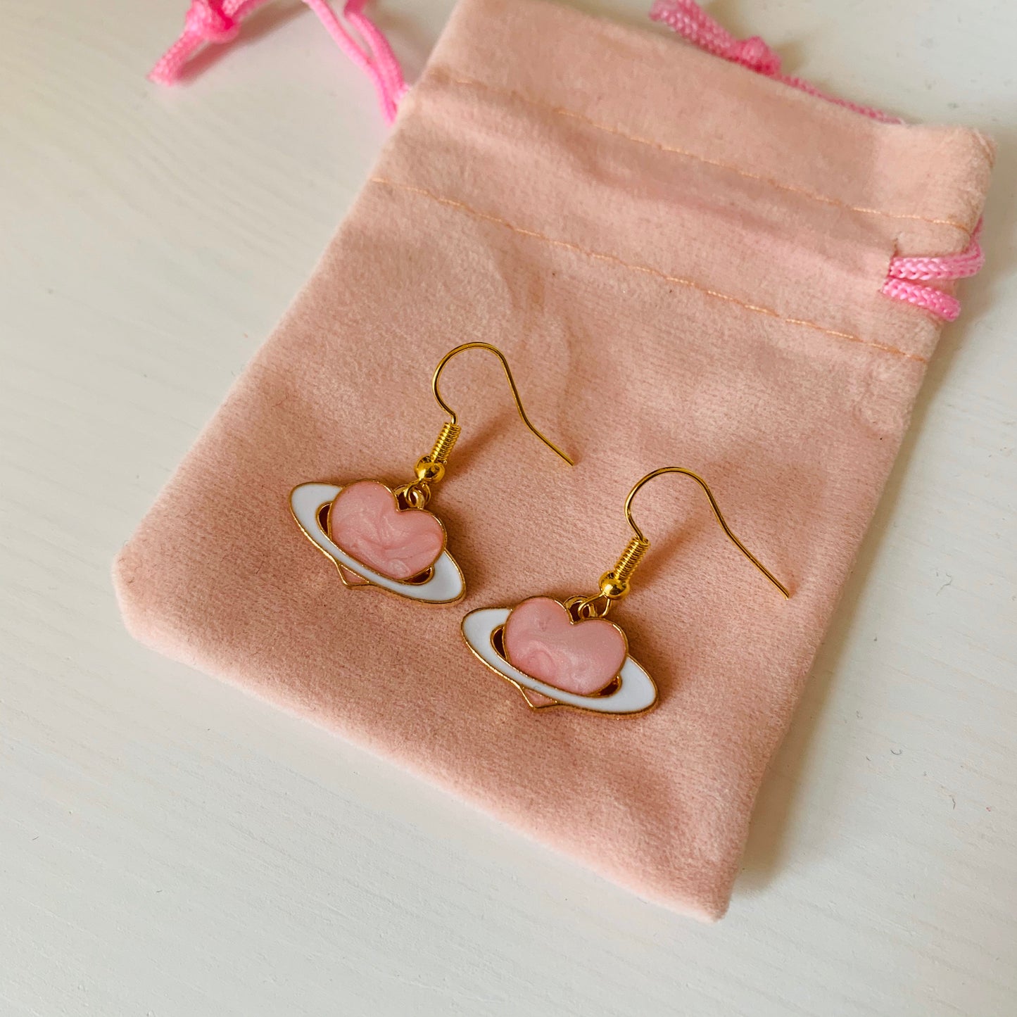 Gold and pink heart saturn planet dangle earrings