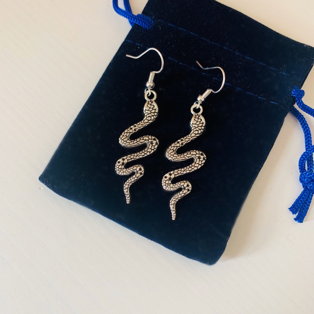 Silver snake dangle earrings