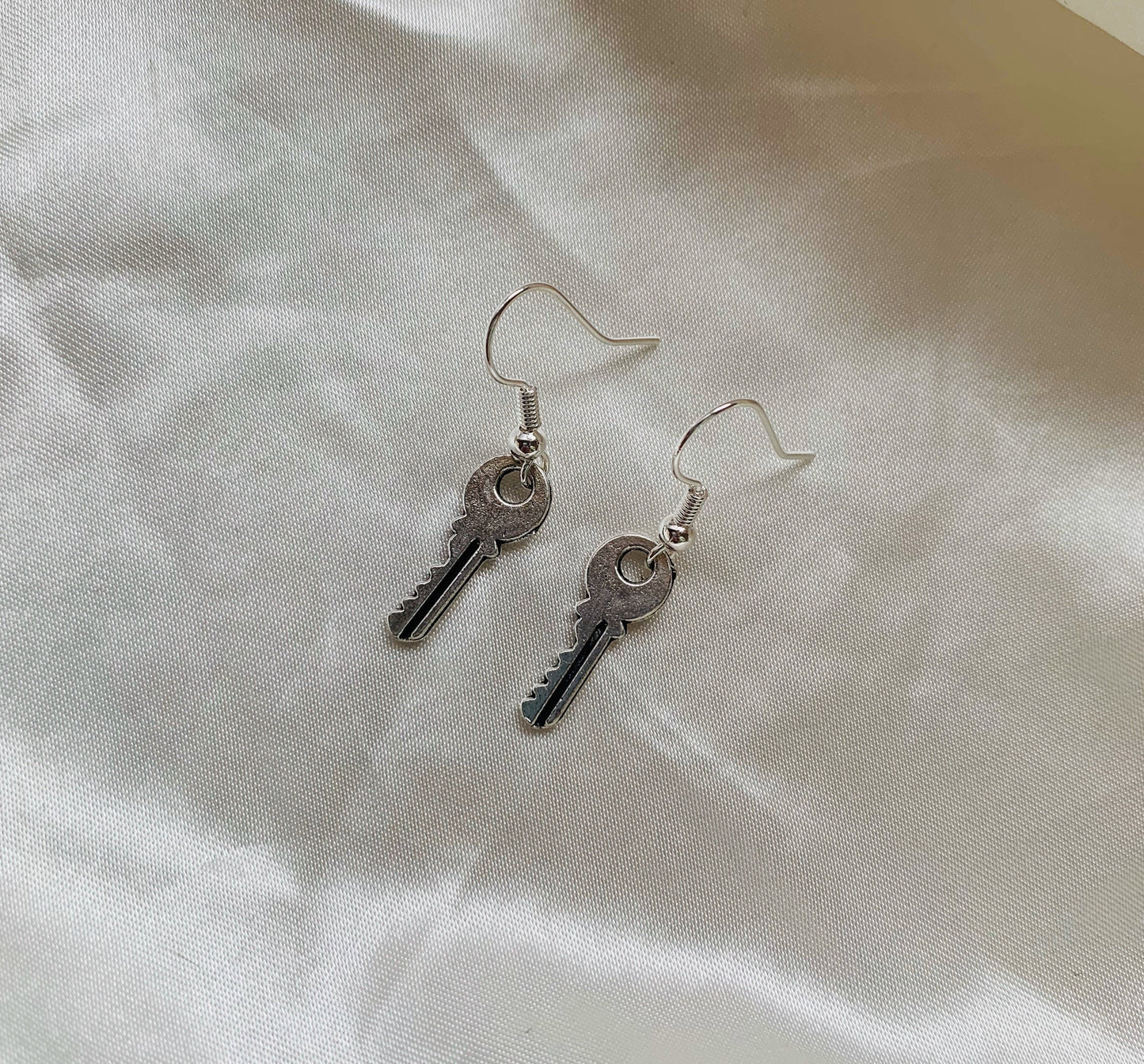 Little silver key dangle earrings