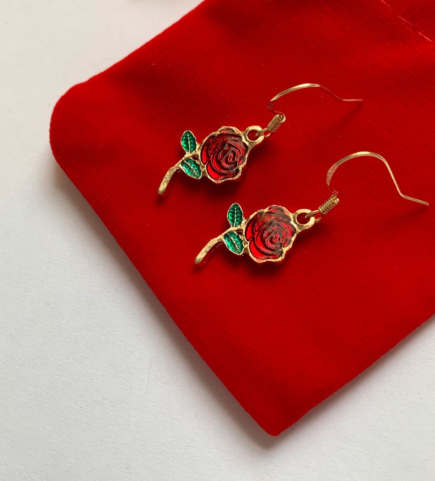 Red rose gold dangle earrings