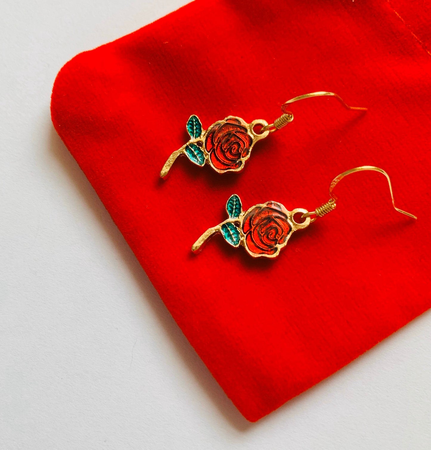 Red rose gold dangle earrings